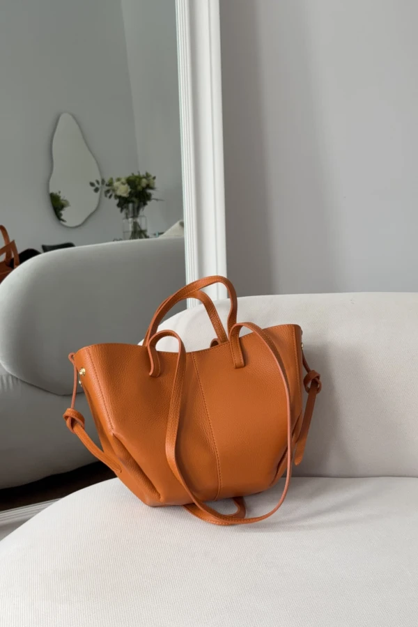 Skórzana torebka Poli midi przygaszony pomarańcz